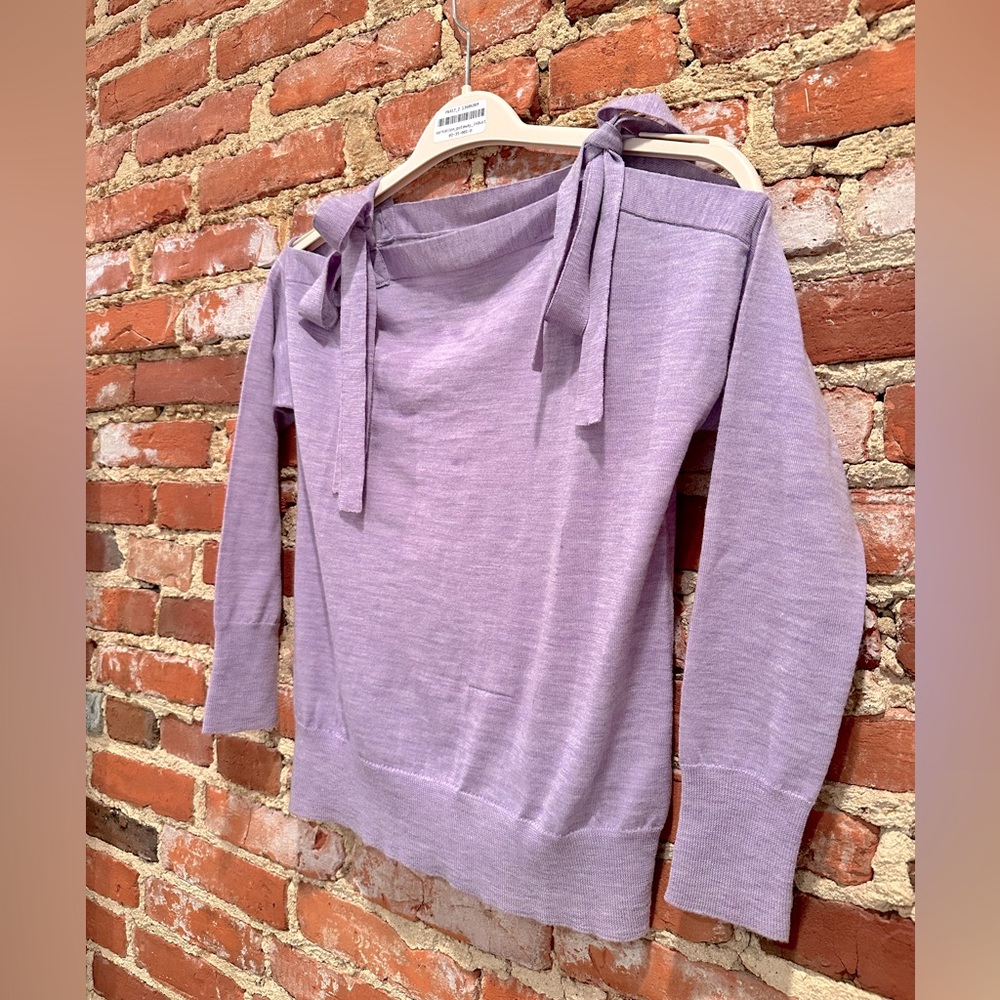 Pale purple J. Crew sweater.  Size: XS.   Fun exposed shoulder detail.